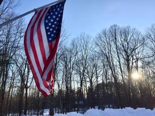 flag against a sunrise