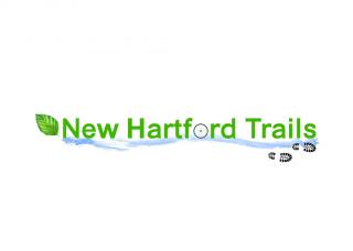 Green lettering New Hartford Trails along a river