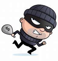 Robber in mask holding bag of money