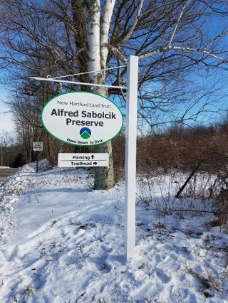 White sign for Alfred Sabolcik Preserve